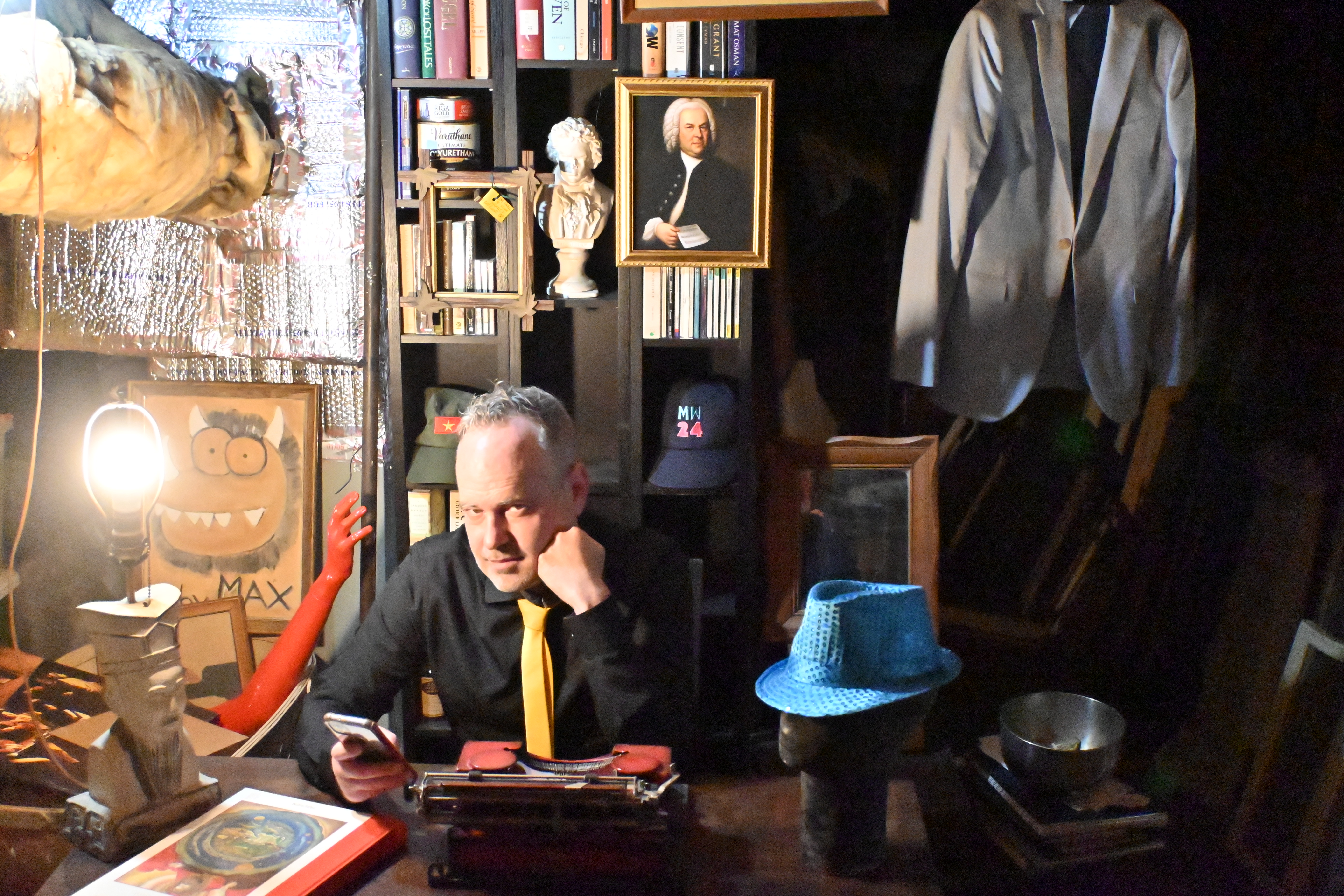 A photo of Max Schmeder at his desk